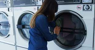Here are 100 fabulous laundry room decor ideas that will set you on the right path. Woman Looking Washing Machine Laundromat Video By C Wavebreakmedia Video Stock Footage 212773570