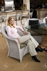 Chances are you'll found another dining room tables with wicker chairs higher design ideas. Portrait Of Smiling Mature Woman Sitting In White Wicker Chair Stock Photo Picture And Royalty Free Image Image 6329023