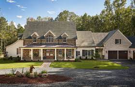 Silver patina castle rock veneer stone interior/exterior natural stone veneer in full or thin stone cladding paired with brick and a neutral tan siding and stucco dormers brings modern farmhouse style to a modern rustic country house setting. Rustic Farmhouse Design Home Bunch Interior Design Ideas
