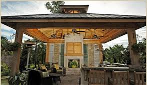Outdoor Kitchen With Cypress Beams And Rough Sawn Columns Metal Roof Reclaimed Shutters Fireplace With Plaster Fini Farmhouse Exterior Outdoor Rooms Outdoor