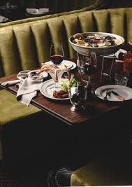 Take out your dining booth and use cabinets and a separate tabletop in order to create a nice, tall dining area. The End Of The Dining Room Is Lined With Three Suede Booths That Holds Up To Six People Picture Of The Gidley Sydney Tripadvisor