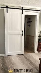 Diy Sliding Barn Door To Replace The Dreaded Pocket Door Tracey S Fancy Diy Sliding Barn Door Diy Barn Door Plans Barn Door Designs