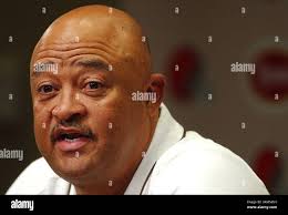Cleveland Browns coach Butch Davis, left, records the hang time of a punt  during training camp in Berea, Ohio, Friday, July 30, 2004. (AP Photo/Luke  Palmisano Stock Photo