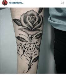 Rose tattoos can be found either on their own, as a small part of a larger body tat, or in a variety of other rose tattoo designs, differences which signify what the rose tat is meant to represent. Rose And Name Tattoo Rose Tattoo With Name Forearm Name Tattoos Tattoos