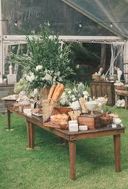 The scrap wood diy tour's first stop is olivia from olivia ohern has made an amazing exotic wood and resin charcuterie board. Brides Com A Rustic Bread Cheese And Charcuterie Table Decorated With A Centerpiece Of Lush Green Wedding Food Bars Wedding Food Table Rustic Food Display