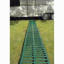 Cut the webbing in half and attach the two pieces across all the planks with staples. Roll Out Path Two Wests Elliott Ltd