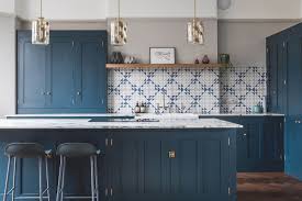 Navy blue is considered a neutral color, yet, when used on cabinetry, becomes a statement making color, that makes the space unique and one of a kind. 6 Countertops That Look Beautiful In A Dark Blue Kitchen