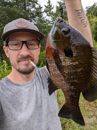 catching a large bluegill in deep water