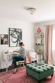 A simple and stylish contemporary home office with green walls, white furniture and a basket as a trash bin. 5 Chic Feminine Home Offices Interior Design Blog Hadley Court