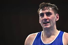 Tense win for Aidan Walsh leaves him one victory away from becoming a  two-time Olympian