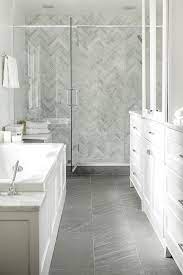 The chevron glass mosaic backsplash in varying hues of blue and gray adds the perfect amount of texture and pattern to this transitional kitchen. A Smart Guide To Low High End Bathroom Flooring Bathrooms Remodel Small Bathroom Remodel Shower Wall Tile