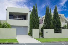 The luzon tropical pine forests are a tropical coniferous forest ecoregion of the philippines in the western pacific ocean. Modern Multilevel House Front With Double Garage Pine Trees Stock Photo Picture And Royalty Free Image Image 12534522
