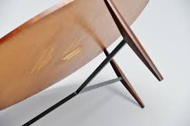 With a trendy black and natural wood combination, this modern bar table design is enhanced by the refined golden details, such as the golden ring in the middle of the countertop. Harry Bertoia 401 Coffee Table Knoll International Usa 1952 Massmoderndesign