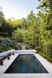 The backyard patio is decorated with patio chairs and table. Ldrqbeymlocx3m
