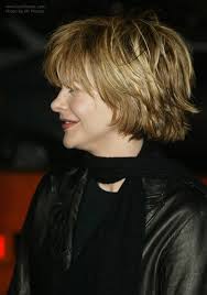 Meg ryan had one of the iconic hollywood haircuts of the '90s: Meg Ryan Wearing Her Hair Short With Layering And Feathering