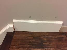 Attached are two pictures of a baseboard transition b/w carpet and hardwood that was installed by the does anyone know if the block that transitions between the two floors is a specialty piece of. Baseboard Against Staircase Doityourself Com Community Forums