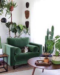 Empty gold frame on the wall above grey and green armchair in living room interior. Pin By Matt Karcher On Inside ï¾ Cheap Living Room Furniture Living Room Green Furniture