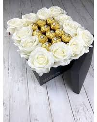 Maybe you would like to learn more about one of these? 12 White Roses With 12 Ferrero Rocher Chocolates In El Paso Tx Angie S Flowers