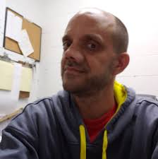 911 caller in Clinton Township states his neighbor kicked over his flower  pots