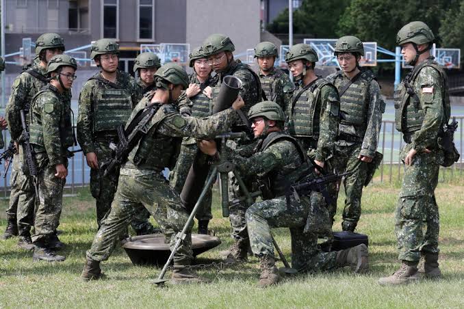 Taiwanese civilians and military personnel participating in nationwide civil defense drills to simulate a response to an attack.