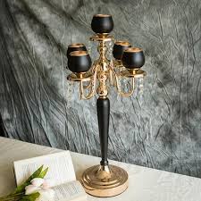 Add five of your favorite pillar candles into the holders for a beautiful glowing effect. 2 Pack Gold Black Metal With Acrylic Crystal Tealight Votive Candle Holder Set 7 11 Candle Holders Votive Candle Holders Candleholder Centerpieces