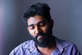 A Man in Blue Button Up Short · Free Stock Photo