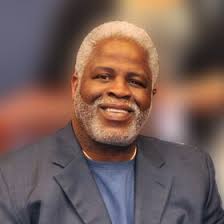 Earl Christian Campbell, nicknamed "the Tyler Rose", is an American former  professional football running back who played in the National Football  League for eight seasons, primarily with the Houston Oilers, celebrates his