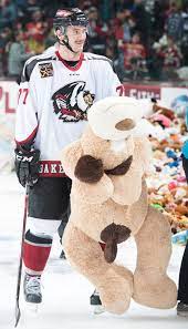 C Chase Schaber Hauls Off A Large Stuffed Animal Following The Teddy Bear Toss Goal Large Stuffed Animals Sport Hockey Favorite Team