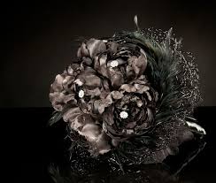A woman then used her dress for court presentation after marriage, usually with a different bodice. Picture Of A Black Halloween Wedding Bouquet Of Blooms Feathers Embellishments And With A Dark Tulle Wrap