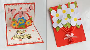 Hands holding a heart mothers day card from easypeasyandfun.com. Handmade Mothers Day Card Mothers Day Pop Up Card Making Idea
