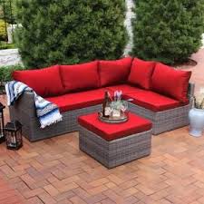 Sunnydaze Decor Port Antonio Gray 4 Piece Wicker Outdoor Sofa Sectional Patio Furniture Set With Red Cushions Mlm 665 R The Home Depot Red Patio Furniture Sectional Patio Furniture Patio Furniture Sets