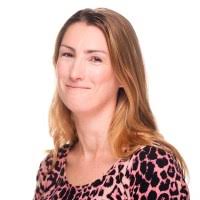 This Great Dane trying to squeeze into a really small dog bed is a triumph  of will over improbability