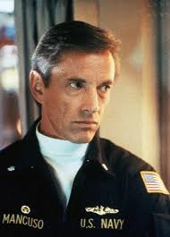 In The Hunt for Red October (1990), Scott Glenn trained for his role of  Commander Bart Mancuso by giving commands to the real-life sub crew of the  USS Salt Lake City, with