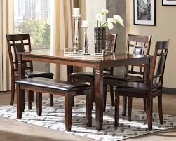 The right materials from a glass dining table that's modern and easy to clean to a sturdy wood kitchen table with bench that adds rustic flair, the right choice is the one. Bennox Dining Room Table And Chairs With Bench Set Of 6 By Signature Design By Ashley Drmdin6pk384 Scholet Furniture