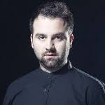 Teksti i këngës Per Flamurin Kuq E Zi nga Riad Ymeri