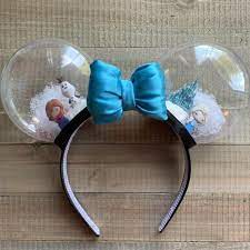 Immerse Yourself In Elsa S Winter Storm With These Frozen Inspired Snow Globe Ears With It Comes Anna Diy Mickey Ears Diy Disney Ears Disney Minnie Mouse Ears
