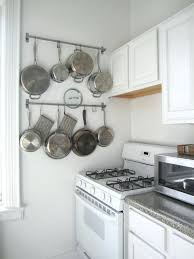 Hanging Pots On Wall Kitchen Pictures To Hang On Wall Inside Designs Architecture Hang Pots Hanging Wall Pots I Small Kitchen Storage Smart Kitchen Pan Storage