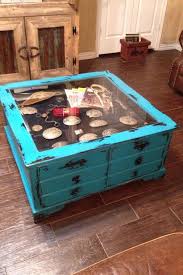 The inky iron frame and glass windows are reminiscent of an art museum case and create a piece with universal appeal and unmatched styling potential. Buckle Display Coffee Table Shadow Box Coffee Table Display Coffee Table Turquoise Coffee Table