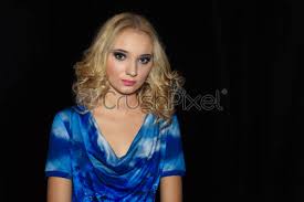 If you haven't tried a blonde shade yet, you absolutely must. Portrait Of Beautiful Girl With Curly Blonde Hair On Black Stock Photo Crushpixel