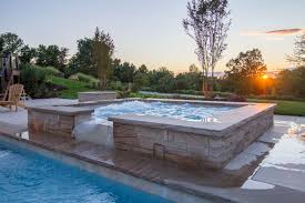 Custom Spillover Spa Trough Spillway Designed To Accommodate Pool Automatic Safety Cover Exterior Backyard Renovations Custom Water Feature Stone Veneer Wall