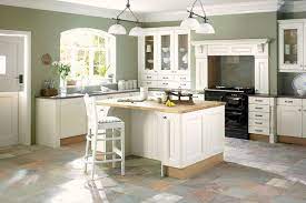 In this kitchen, it complements warm wood shutters and barstools and a green floral wallpaper. Imgur Com Sage Green Kitchen Walls Green Kitchen Walls Shaker Style Kitchen Cabinets