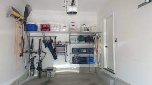 Optimizing Space In One Car Garage With Garden Tool Rack High Shelving And Wall Storage Garage Organization Diy Garage Design Interior Garage Storage Systems