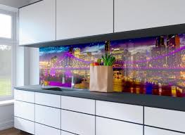 In a sea of grays and warm woods, a watery green backsplash creates a colorful focal point in this open kitchen. 6 Advantages On Kitchen Glass Splashbacks To Have