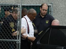 A new prison mug shot shows bill cosby smiling with a disposable mask hanging off his face. Bill Cosby Isolated No More Joins Other Inmates In Prison The New York Times