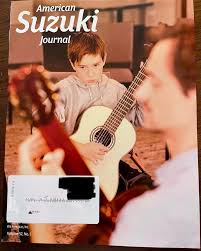 We made the cover of The American Suzuki Journal! Our talented Institute  photographer Curt Biesterfeld captured this photo of one of our terrific  2023 guitar students with teacher, Jacob Jonker! ☺️🎶