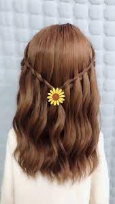 The Girl S Long Hair Is Braided 8 Video Hair Styles Long Hair Styles Hair