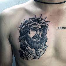 The cross tattoo on the chest can be drawn on either of the sides with some small figures around or it can be drawn in the center with wing or jesus on it. 40 Jesus Chest Tattoo Designs For Men Chris Ink Ideas