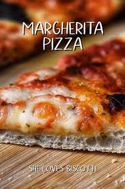 The Classic Margherita Pizza Simply Made With Mozzarella Tomato Sauce And Garnished With Fresh Basil Leaves Pizza Recipes Easy Margherita Pizza Cookout Food