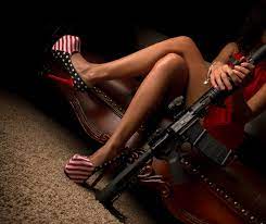 Smiling asian woman looking at pregnant woman on chairs in hall. Wallpaper Weapon Legs Crossed Women High Heels Girls With Guns 3840x3227 Wallpapermaniac 1224506 Hd Wallpapers Wallhere