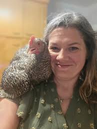 Here is my youngest, Carol. She has just finished helping fix the chickens,  ducks, and goats night time meal. I went to a livestock sale and Carol was  in a chicken cage
